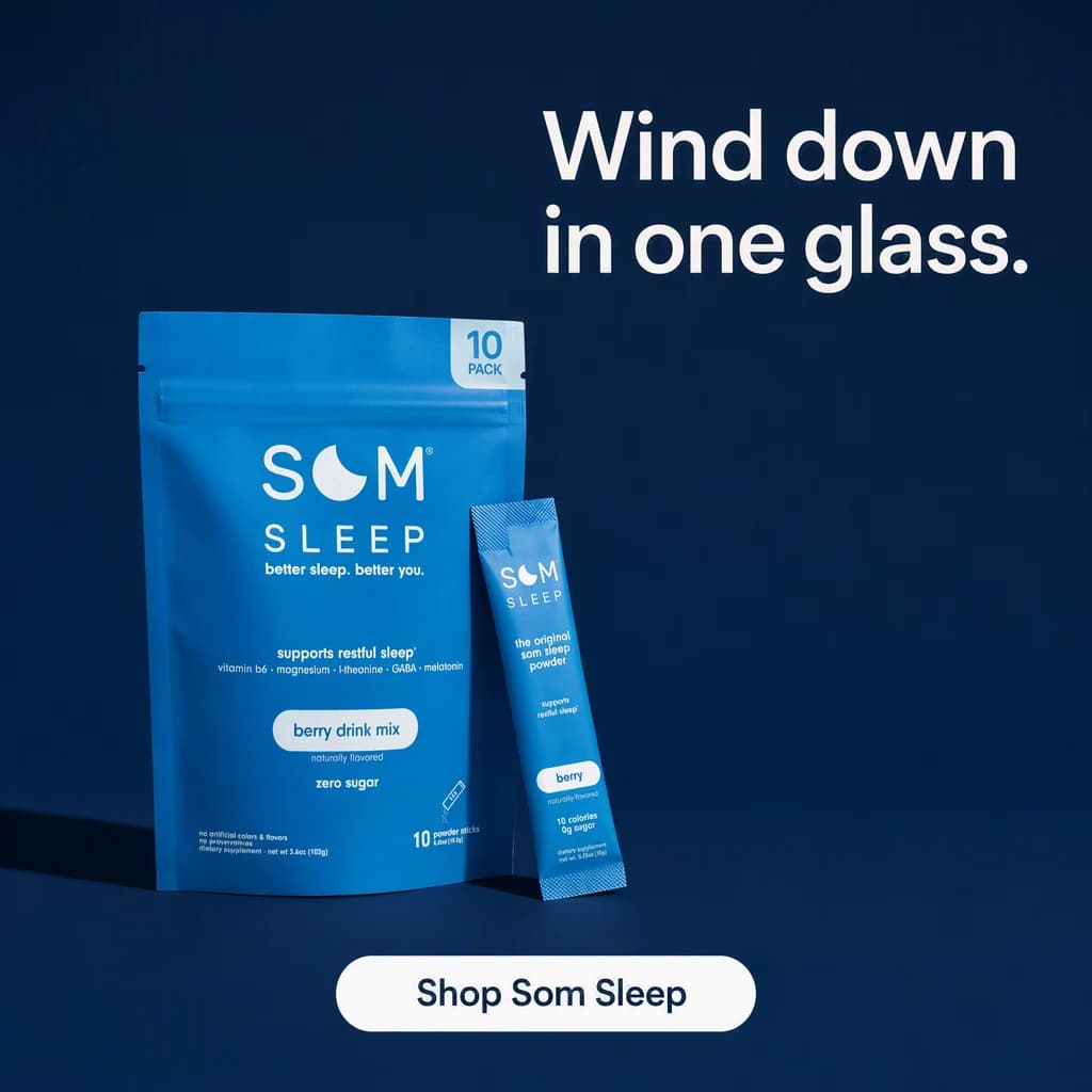 A blue Som Sleep pouch and one loose stick pack standing low in the left of a deep navy field with one hard key light throwing a long shadow, the upper right quadrant left open for the line and a wide button along the bottom edge.