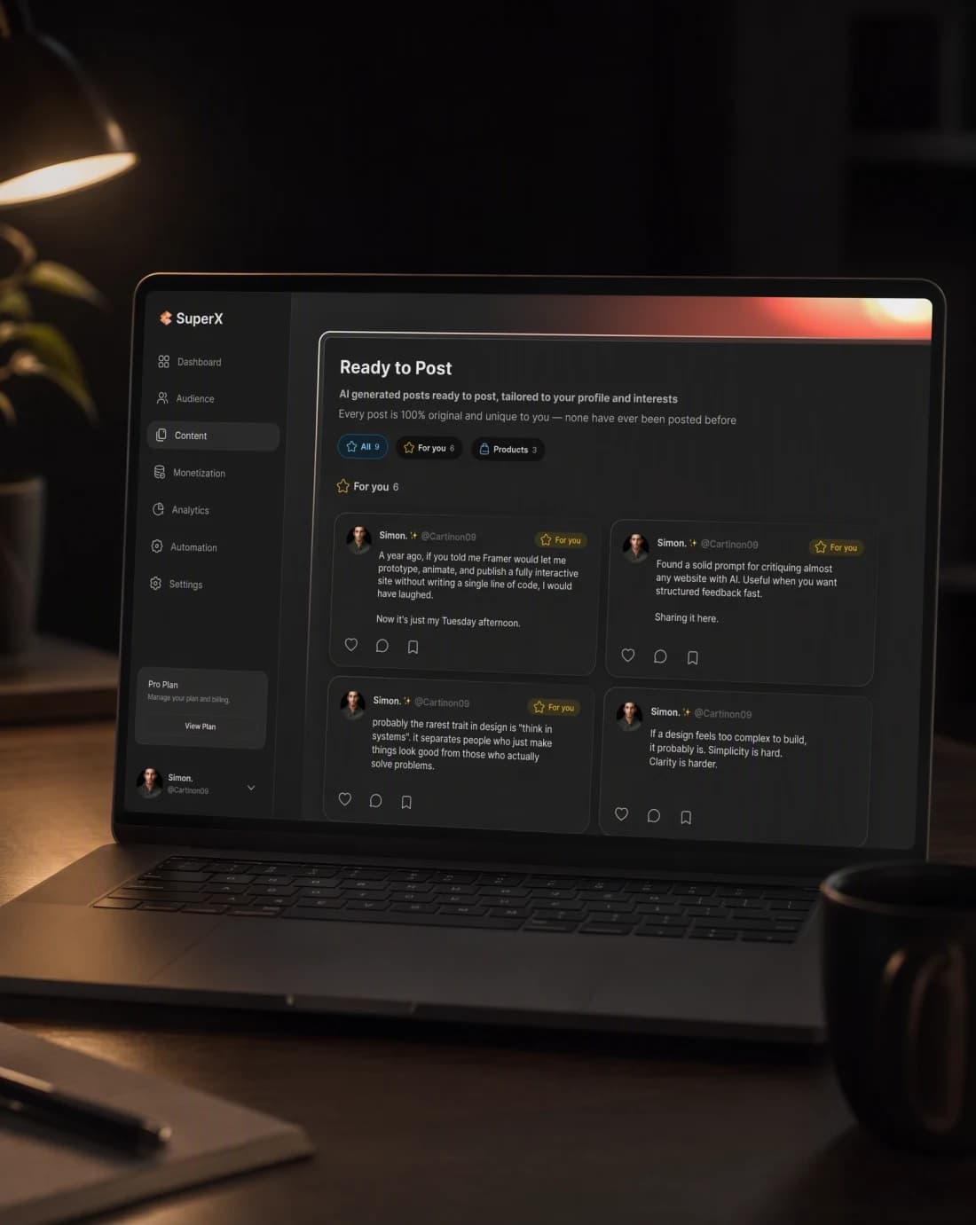A laptop showing the SuperX content dashboard on a dark desk, lit by one warm key light at night.